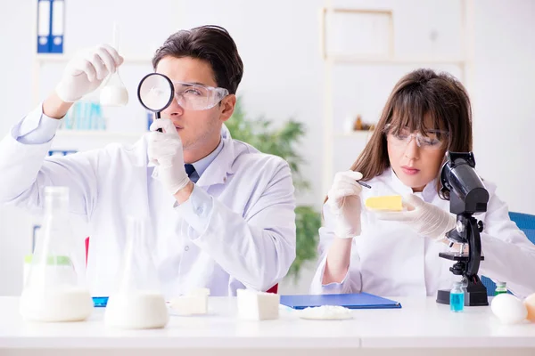 Two lab doctor testing food products