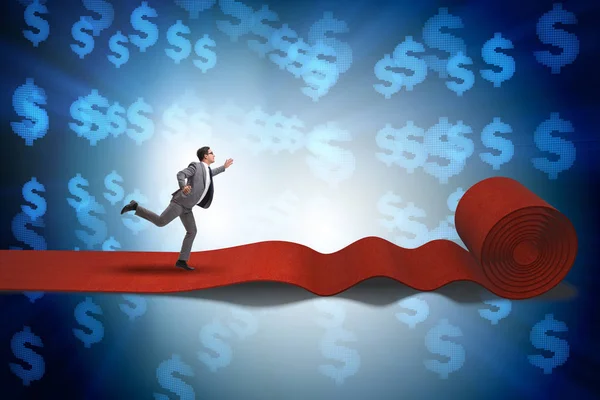 Empresário com dólares no tapete vermelho — Fotografia de Stock