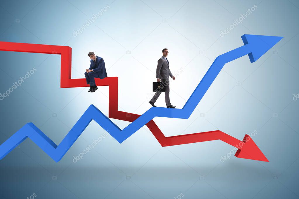 Businessman with charts of growth and decline