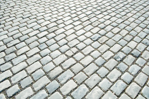 Estrada pavimentada com pedras de calhau para o seu fundo — Fotografia de Stock