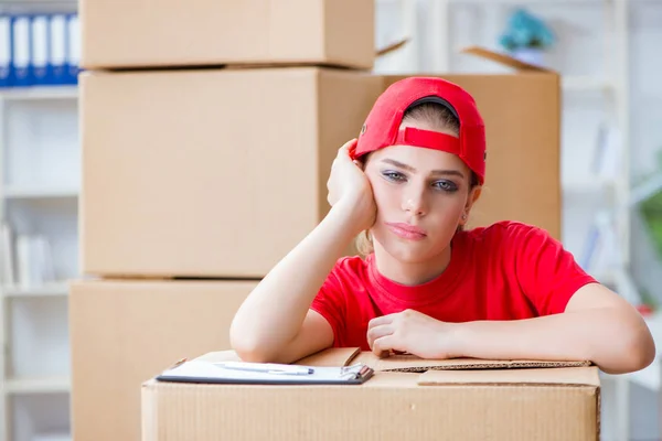 Young woman delivering boxes of personal effects Stock Picture