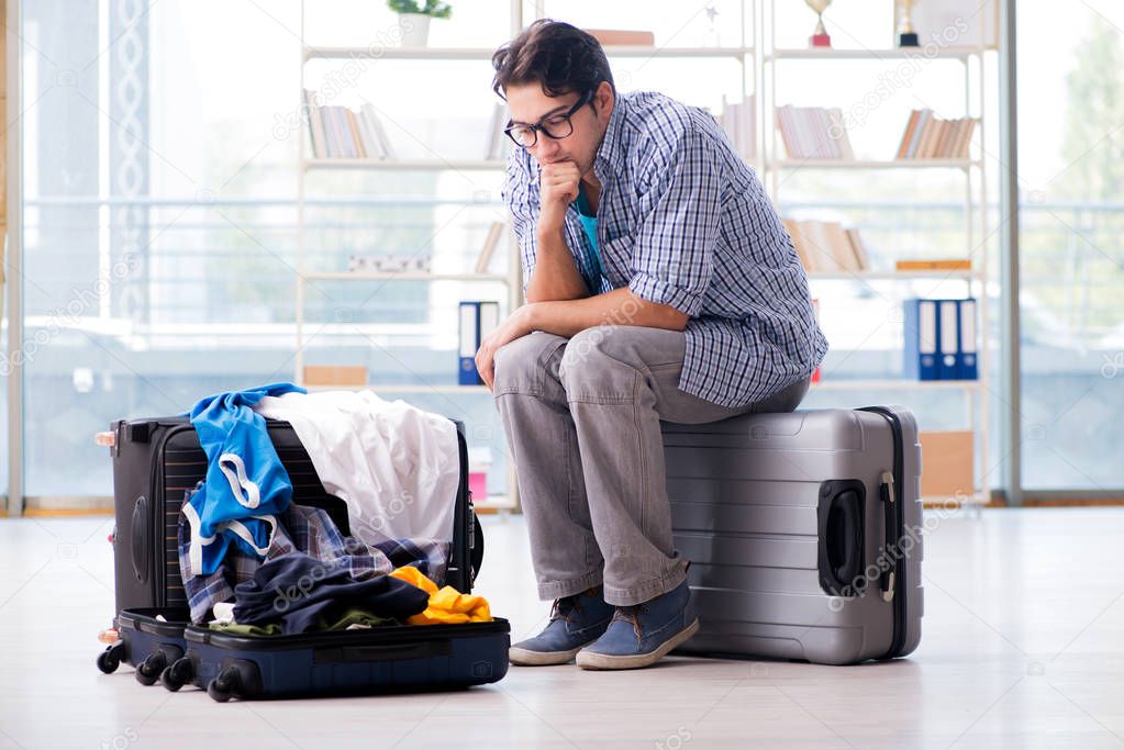 Young man preparing for vacation travel