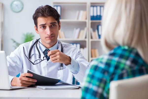 Patient visiting doctor for medical check-up in hospital Royalty Free Stock Images