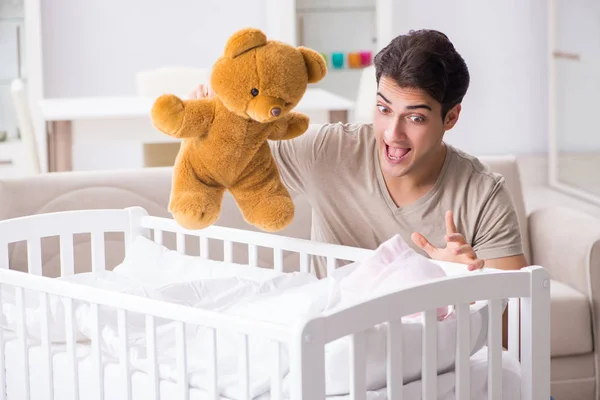 Young father enjoying time with newborn baby at home — Stock Photo, Image