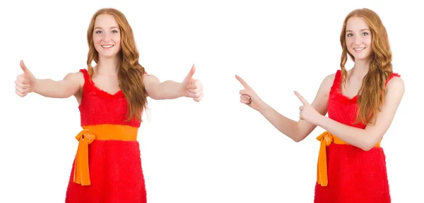 Young beautiful girl in red dress pointing isolated on white — Stock Photo, Image