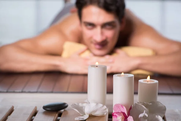 Young handsome man during spa procedure — Stock Photo, Image