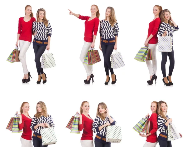 Friends with shopping bags isolated on white — Stock Photo, Image