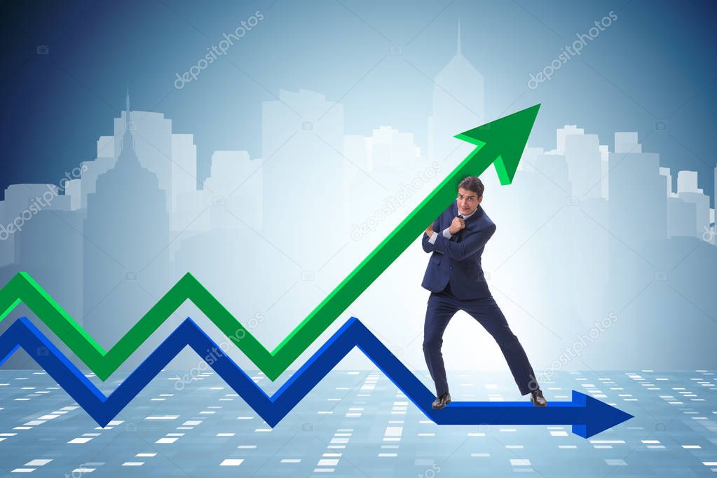 Businessman supporting growtn in economy on chart graph