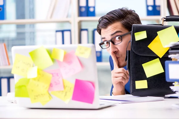 Businessman with reminder notes in multitasking concept — Stock Photo, Image