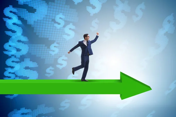 Businessman with dollar walking on arrow sign — Stock Photo, Image