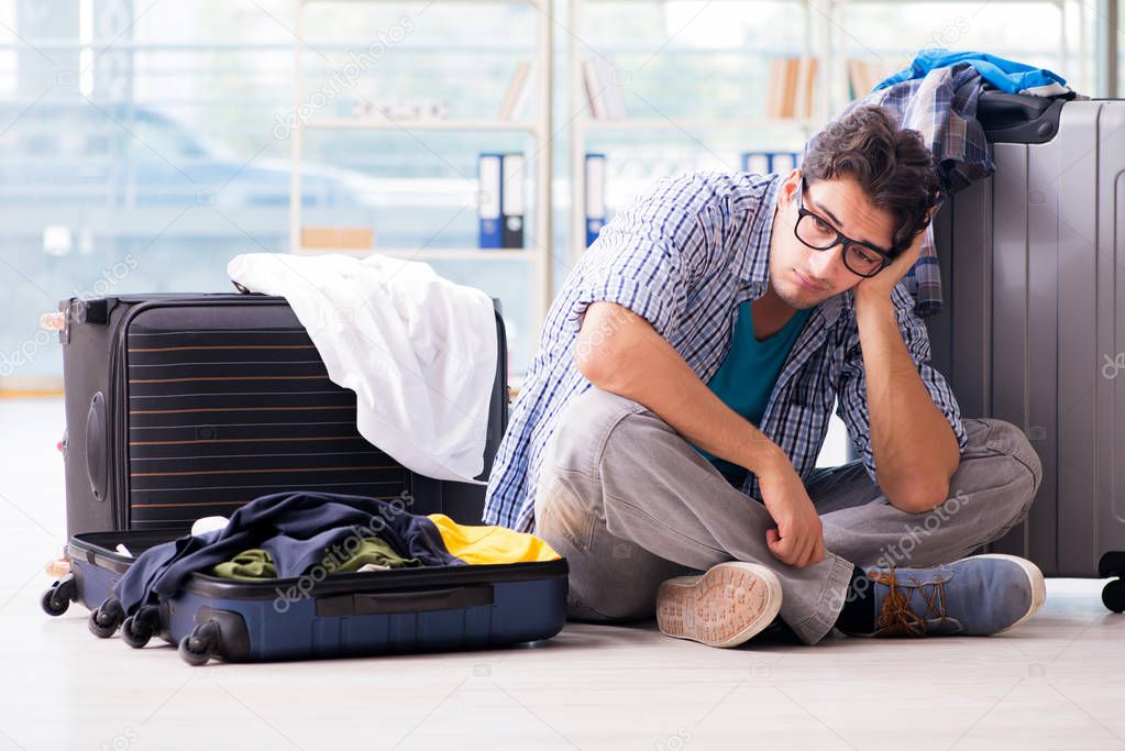 Young man preparing for vacation travel