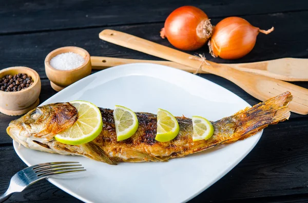 Fried fish served on the plate — Stock Photo, Image