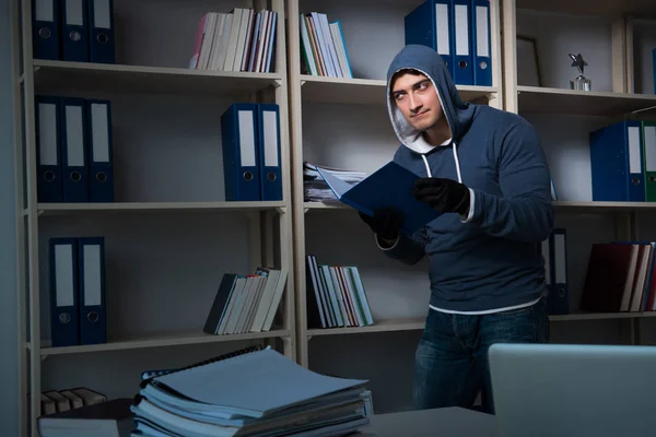 Young man in industrial espionage concept — Stock Photo, Image
