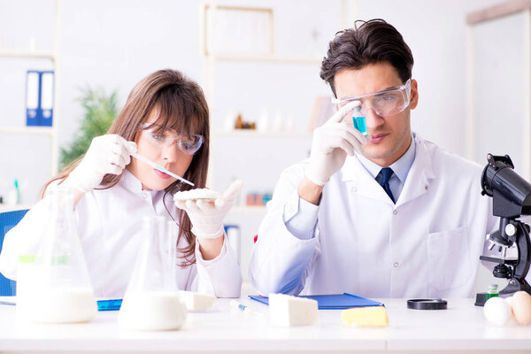 Two lab doctor testing food products