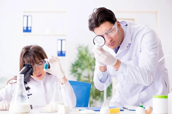 Two lab doctor testing food products