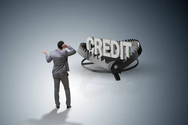 Businessman falling into the trap of loan credit — Stock Photo, Image