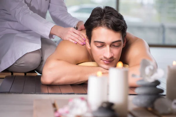 Young handsome man during spa procedure — Stock Photo, Image