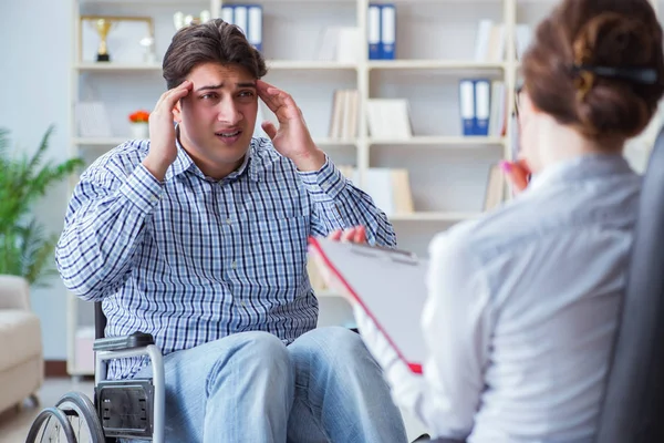 Patient visiting psychotherapist to deal with consequences of tr