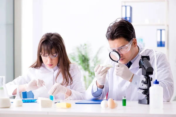 Two lab doctor testing food products