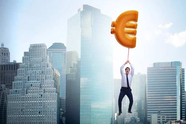 Empresario volando en euro signo inflable globo —  Fotos de Stock