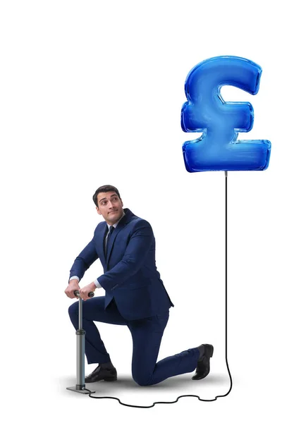 Бизнесмен накачивает британский фунт стерлингов знак в бизнес-conc — стоковое фото