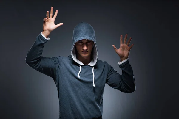 Young man wearing hoodie pressing virtual buttons — Stock Photo, Image