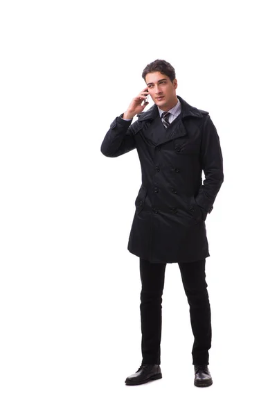 Молодой бизнесмен в зимнем пальто изолирован на белом — стоковое фото