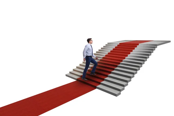 Молодий бізнесмен скелелазіння сходів і червоний килим на білому фоні — стокове фото