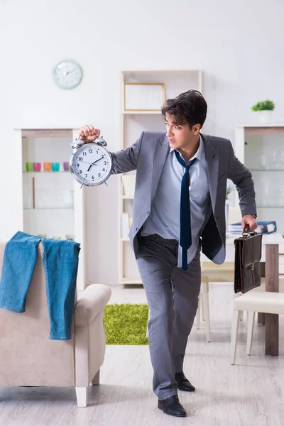 Businessman late for office due to oversleeping after overnight working — Stock Photo, Image