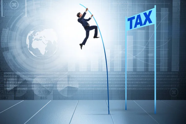 Businessman jumping over tax in tax evasion avoidance concept — Stock Photo, Image