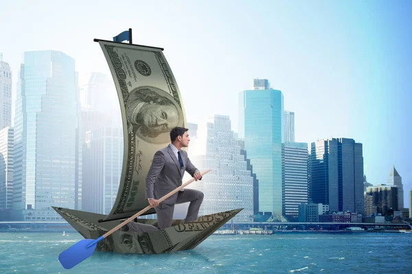 Affärsman rodd på dollarbåt i business financial koncept — Stockfoto