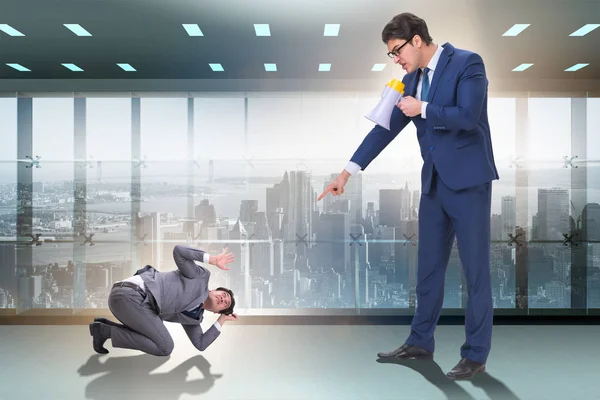 Bad angry boss shouting at employee with loudspeaker — Stock Photo, Image