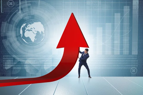 Affärsman som stöder tillväxten i ekonomin i diagrammet — Stockfoto