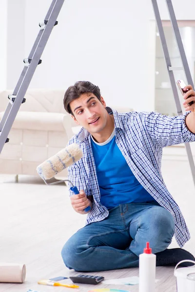 Young man overspending his budget in refurbishment project — Stock Photo, Image