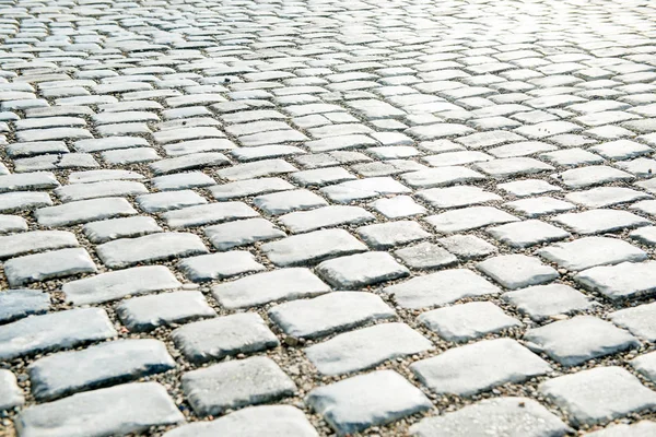 Estrada pavimentada com pedras de calhau para o seu fundo — Fotografia de Stock