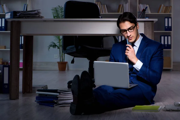 Businessman working overtime long hours late in office — Stock Photo, Image