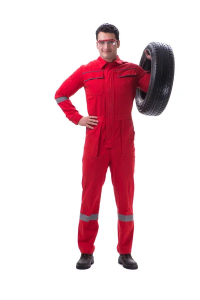 Young tyre repairman in red coveralls isolated on white backgrou — Stock Photo, Image