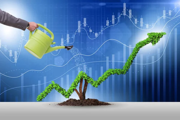 Businessman in investment concept watering financial line chart — Stock Photo, Image