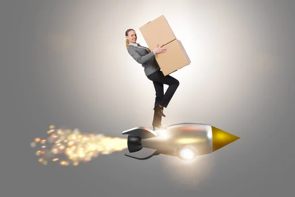 Woman flying rocket and delivering boxes — Stock Photo, Image