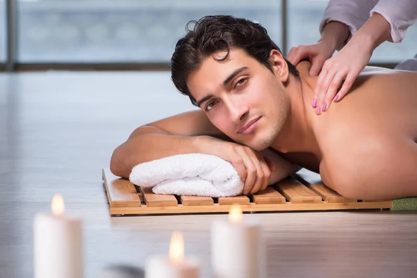 Young handsome man during spa procedure — Stock Photo, Image