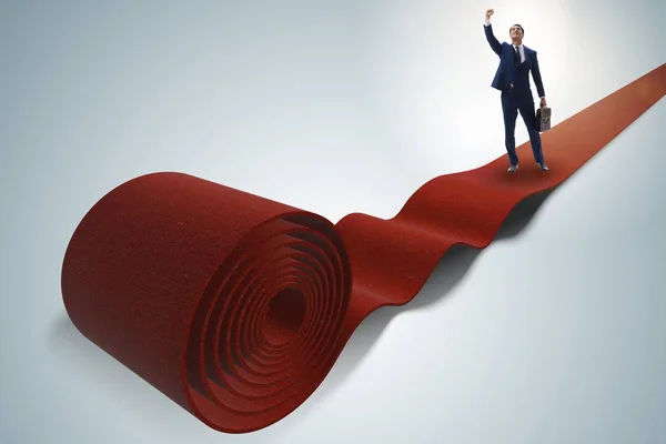 Businessman on the red carpet in success concept — Stock Photo, Image