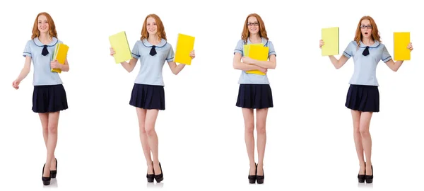 Junge fleißige Studentin mit Schulbüchern auf weißem Grund — Stockfoto