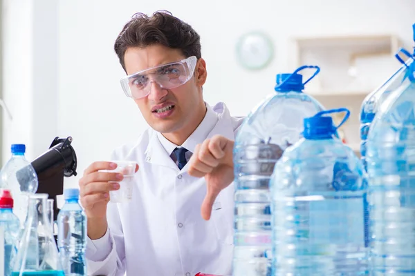 Lab assistant testing water quality