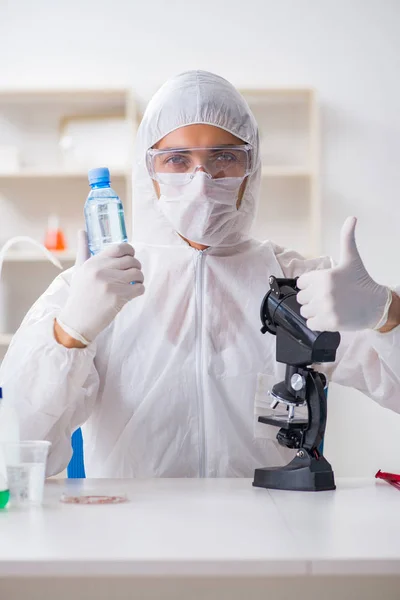 Lab assistant testing water quality