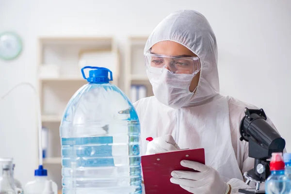 Lab assistant testing water quality