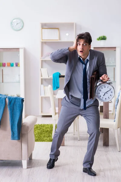 Businessman late for office due to oversleeping after overnight working — Stock Photo, Image