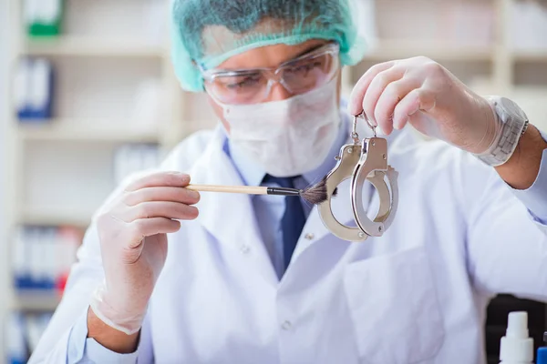 Criminologist police chemist looking at crime evidence — Stock Photo, Image