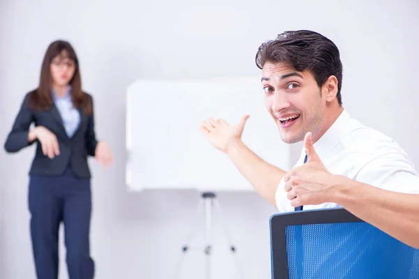 Business presentation in the office with man and woman — Stock Photo, Image