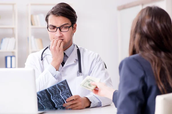 Doctor in corruption concept with being offered bribe — Stock Photo, Image