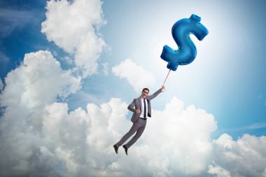 Dolar işareti üzerinde uçan iş adamı şişme balon